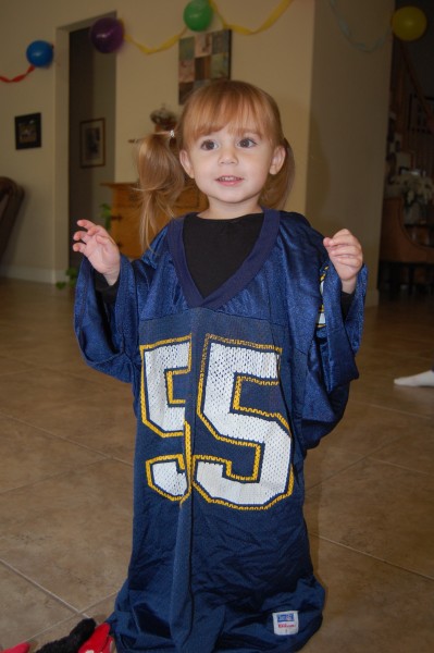2 years old. A quarter of her life. We take pictures in Daddy's favorite jersey every year. 